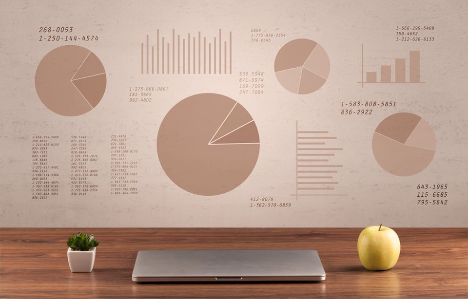 Graphic business office desk with pie charts and graphs on the brown sepia background wall